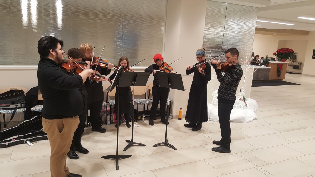 Jingle Bells Performers with directors Joseph Alcocer (far left) and Steven Fernandez (far right)